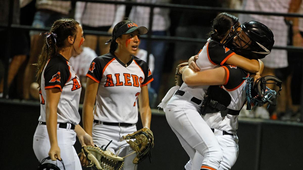 Aledo pitcher Brenlee Gonzales jumps into the arms of her catcher Breleigh Mayer after winning game one of the UIL Conference 5A Region 1 final softball game at Aledo, Texas, Wednesday, May 22, 2024.