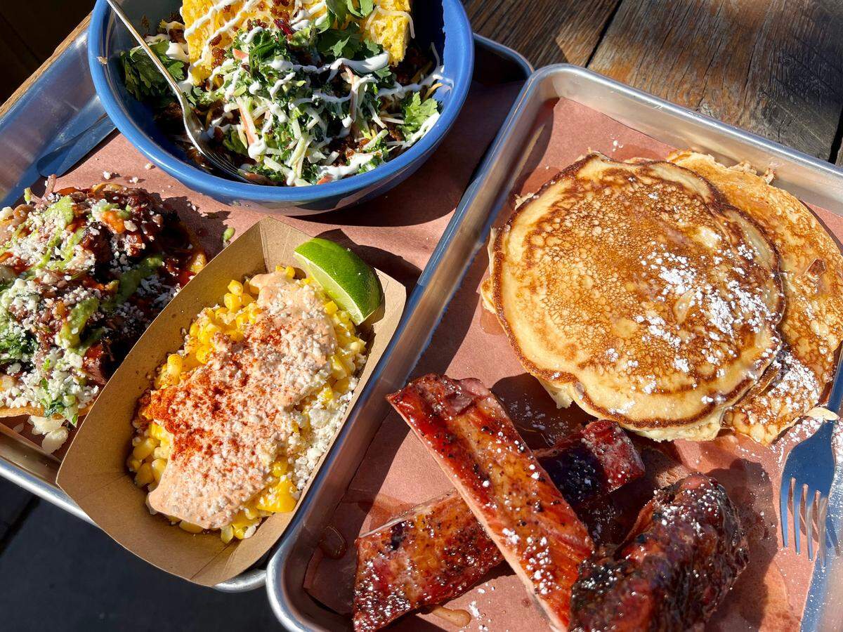 Brunch at Del Toro BBQ: Pancakes with honey-glazed ribs, elote, a brisket chalupa and cornbread with chili and cole slaw.