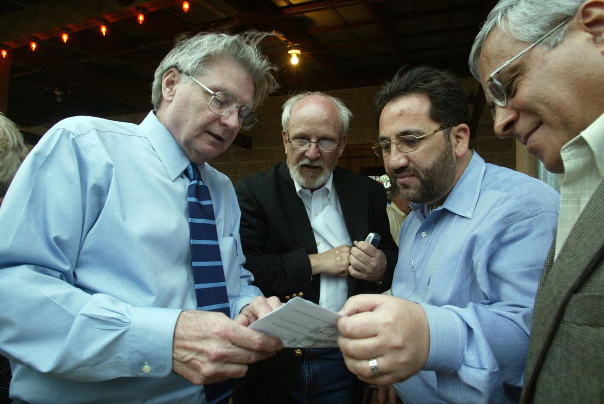 April 11, 2006: Former Southlake Mayor Gary Fickes, center, Republican candidate for Tarrant County commisioner, Precinct 3, talks with supporters Tom Wilder, Tarrant County district clerk, left; Jamal Qaddura and Barkat Ali on election night at the Railhead Restaurant in Colleyville.