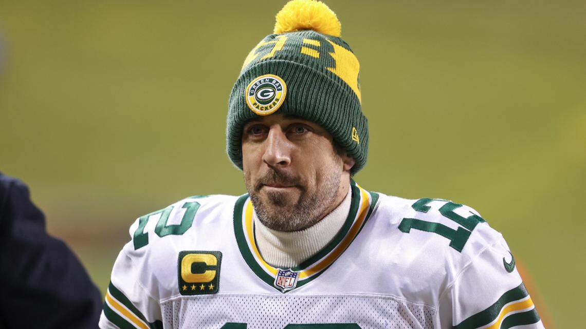 Green Bay Packers quarterback Aaron Rodgers (12) walks off the field after an NFL football game against the Chicago Bears, Sunday, Jan. 3, 2021, in Chicago. (AP Photo/Kamil Krzaczynski)