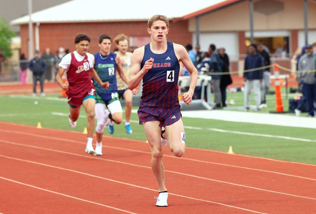 Northwest High School runner Cooper Lutkenhaus competes in a track and field meet last year.