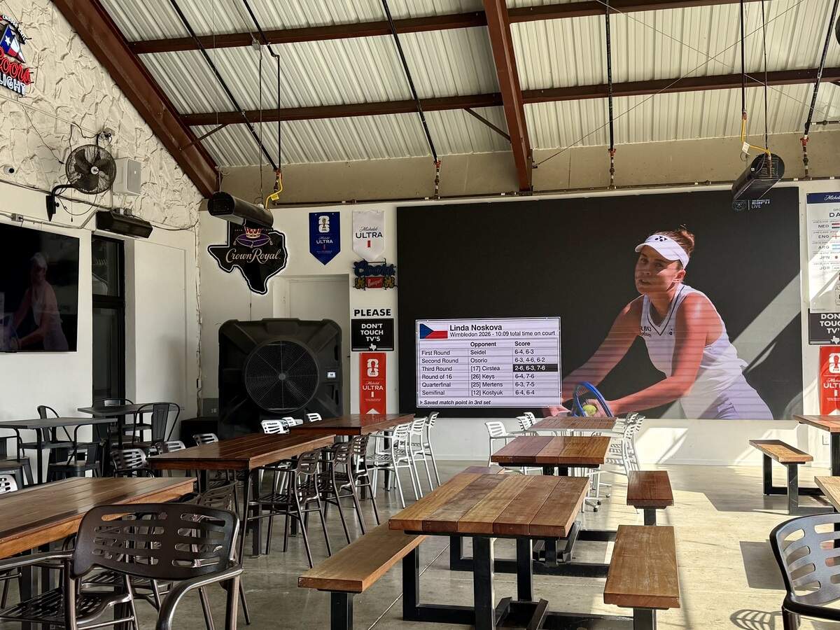 Rex’s Bar & Grill has a covered east patio with a giant TV, as seen July 11, 2026.