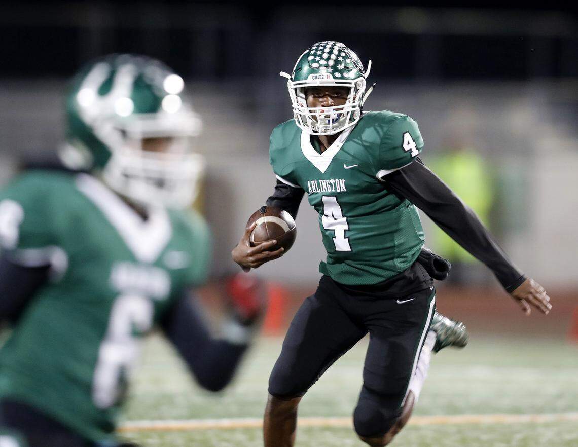 Arlington quarterback Jahari Rogers (4) takes off on a quarterback keeper during the first half of a high school football game at Maverick Stadium in Arlington, Texas, Thursday, Nov. 08, 2018. Lamar led 10-7 at the half. (Special to the Star-Telegram Bob Booth)