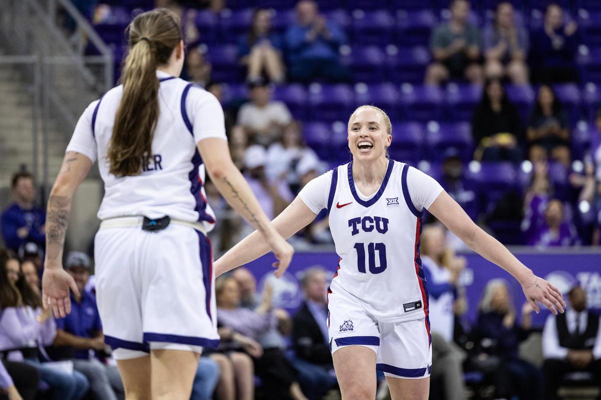 TCU guards Madison Conner (2) and Hailey Van Lith (10) celebrate after Conner made a three-point shot in the first half an NCAA game between TCU and Houston at Schollmaier Arena in Fort Worth on Wednesday, Feb. 26, 2025.