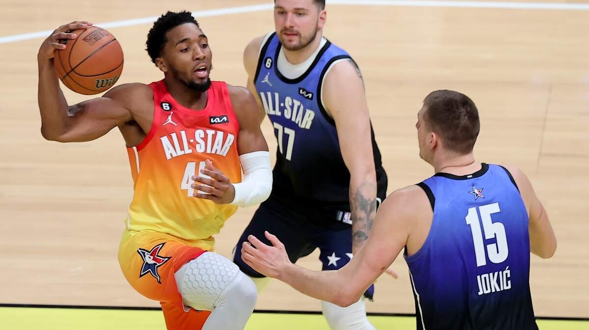 Team Giannis guard Donovan Mitchell (45) drives past Team LeBron forward Luka Doncic (77) and Team LeBron center Nikola Jokic (15) during the first half of the NBA basketball All-Star game Sunday, Feb. 19, 2023, in Salt Lake City. (AP Photo/Rob Gray)