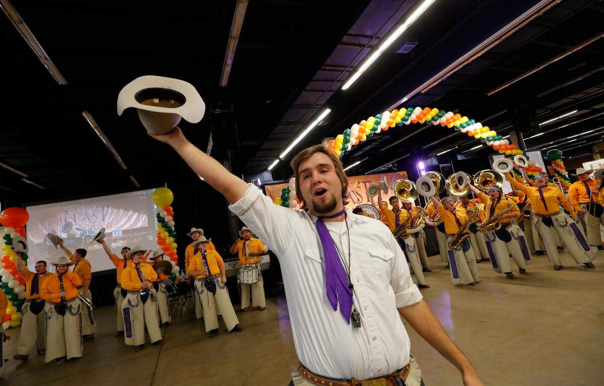 Drum major David Spruiell leads the Cowboy Band from Hardin-Simmons University at the H-E-B/Central Market Feast of Sharing at Will Rogers Memorial Center on Nov. 12, 2013.