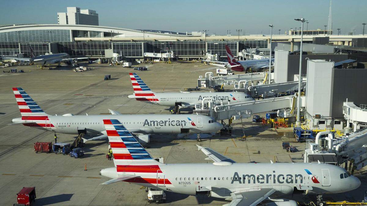American Airlines planes are seen at the gates of Terminal D at Dallas-Fort Worth International Airport on Feb. 3, 2023.