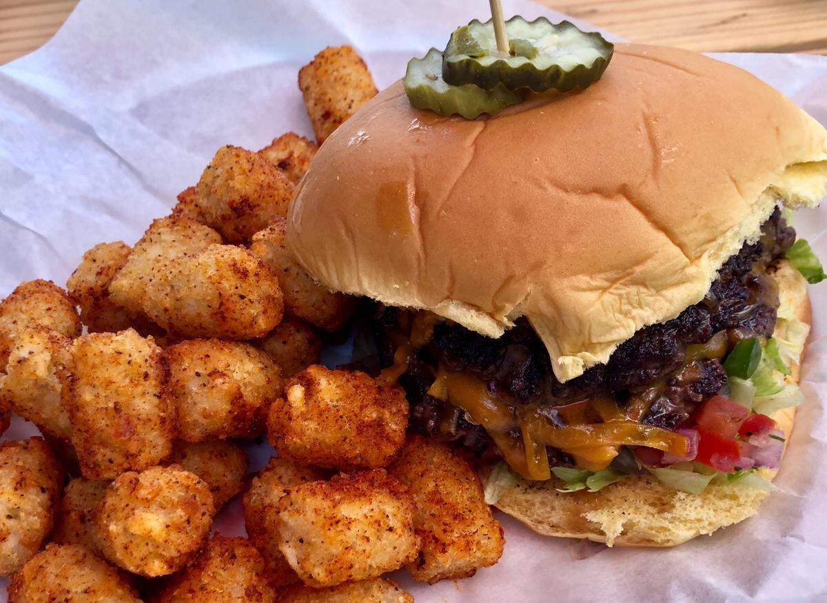 The Rogers RoundHouse burger with seasoned tater tots.