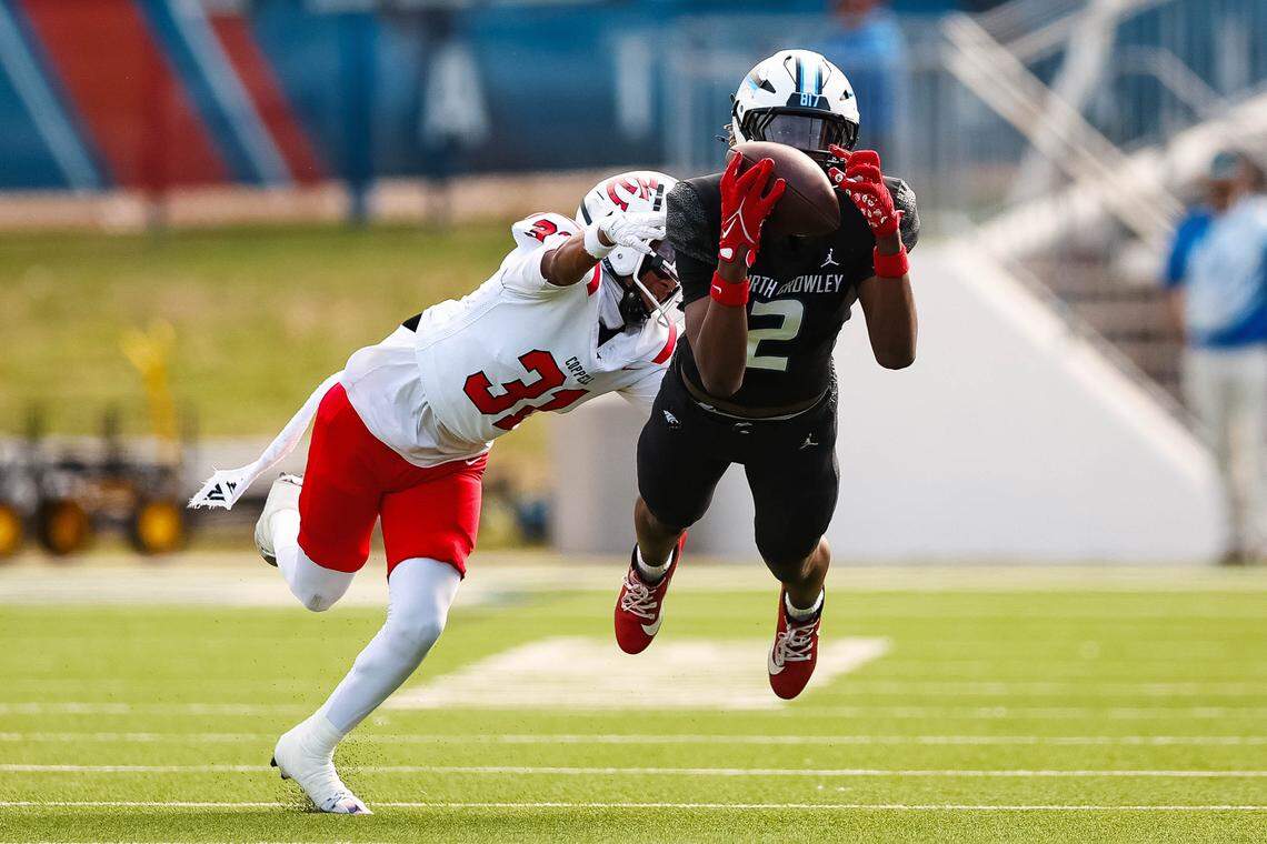 North Crowley wide receiver Damarion Mays (2) dives in the air in an attempt to make a catch in a Class 6A Division I regional playoff against Coppell on Saturday, Nov. 29, 2025, at Midlothian ISD Stadium in Midlothian.