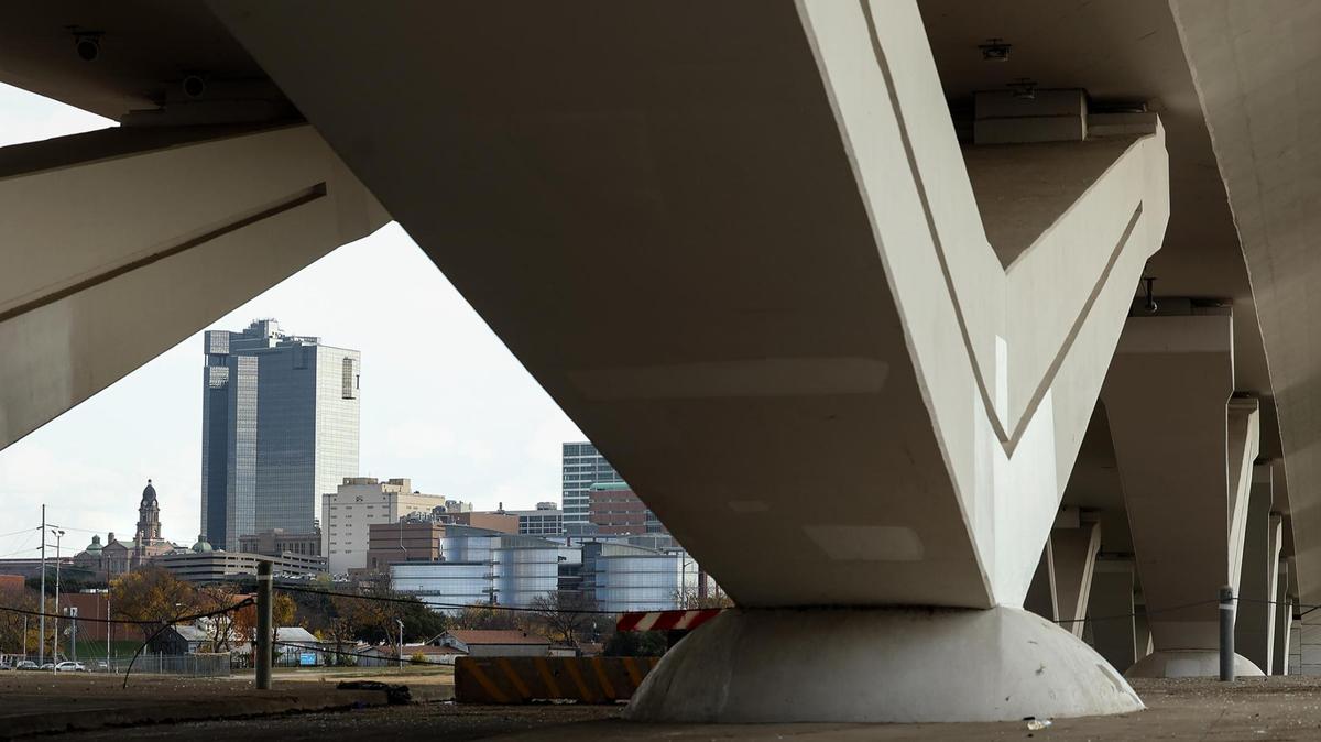 Downtown Fort Worth can be seen from under the Henderson Street bridge on Monday, Dec. 16, 2024. Delays have plagued the Panther Island project. It took the Texas Department of Transportation roughly six years and $126.2 million to complete the three bridges designed to funnel traffic to and from the island.