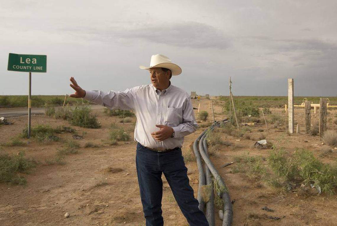 New Mexico State Land Commissioner Aubrey Dunn stands along Highway 652 below the Lea County sign at the Texas-New Mexico border on May 23, 2018.
