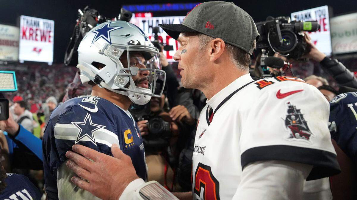 Tampa Bay Buccaneers quarterback Tom Brady (12) and Dallas Cowboys quarterback Dak Prescott (4) greet each other at midfield following an NFL wild-card football game, Monday, Jan. 16, 2023, in Tampa, Fla.