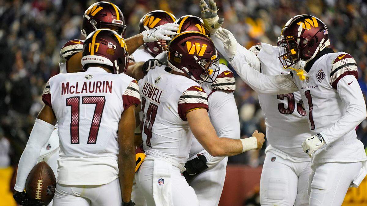 Washington Commanders quarterback Sam Howell (14) celebrating his touchdown against the Dallas Cowboys during the second half an NFL football game, Sunday, Jan. 8, 2023, in Landover, Md. (AP Photo/Patrick Semansky)