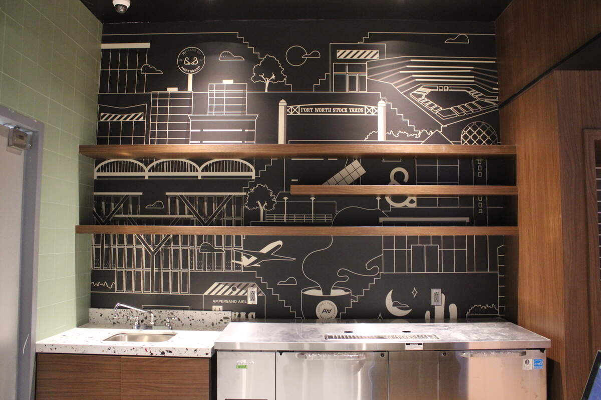 One of the murals in Ampersand’s DFW store show glimpses of the Stockyards and the original Ampersand locations.