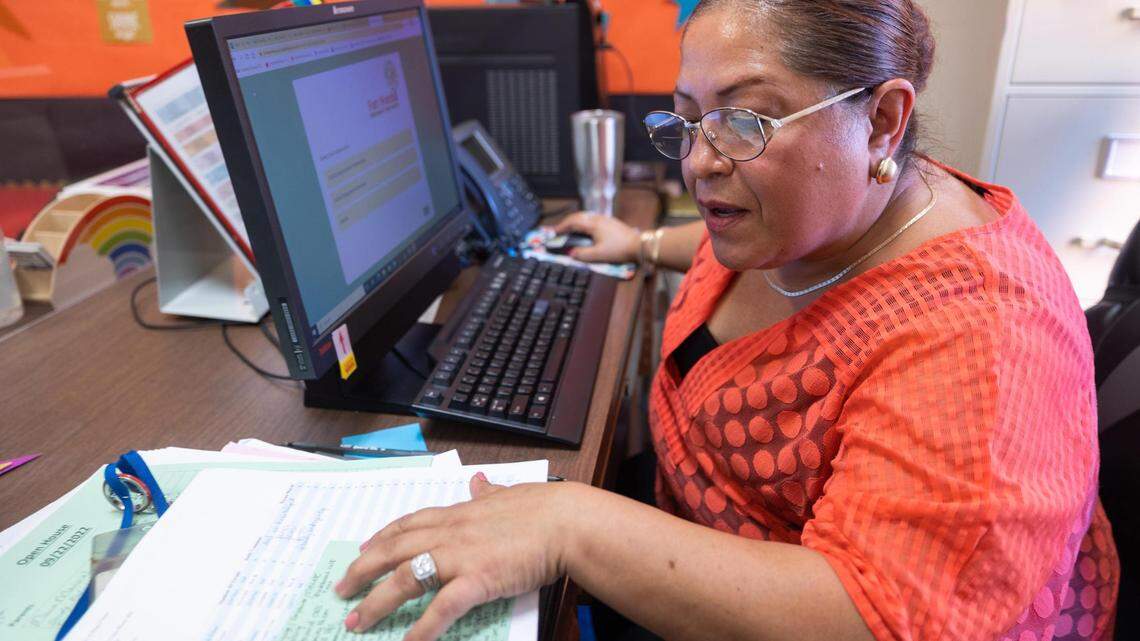 Saira Olivo, family engagement specialist, makes calls to absentee students on Sept. 27, 2022, at Cesar Chavez Elementary School in Fort Worth. Olivo helps families get support services to ensure they are successful.