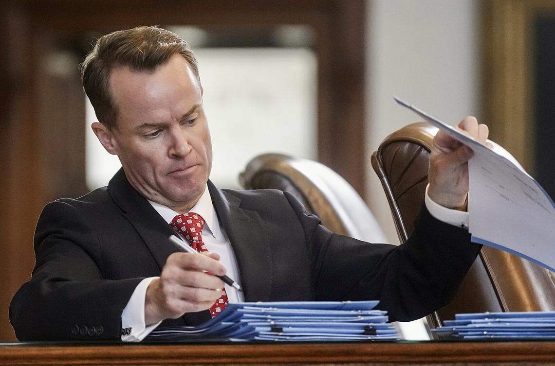 Rep. Dade Phelan, R-Beaumont, signs bills during Sine Die in the House of Representatives at the Texas Capitol on Monday, May 29, 2023.
