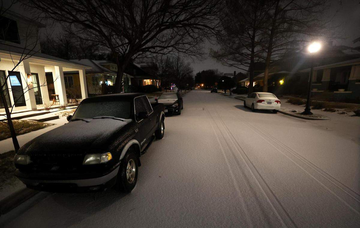 Snow covers the roads in the Fairmount neighborhood of Fort Worth before the sun rises on Thursday, February 3, 2022. North Texas is under a winter weather warning until 6 p.m. Thursday, but icy conditions may not begin to improve until Friday or later in the weekend.