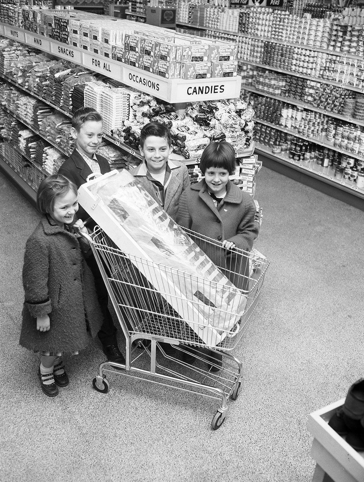 Dec. 5, 1955: This 102-pound Baby Ruth candy bar will provide plenty of good eating for youngsters in Tarrant County Children’s Home. The giant bar, equivalent to 820 regular bars, was given the home by the Westcliff Wyatt Food Store. The four children who accepted the candy are, left to right, Linda Kay Fenton, A.J. Green, Frank Keith and Glenda Dodd.