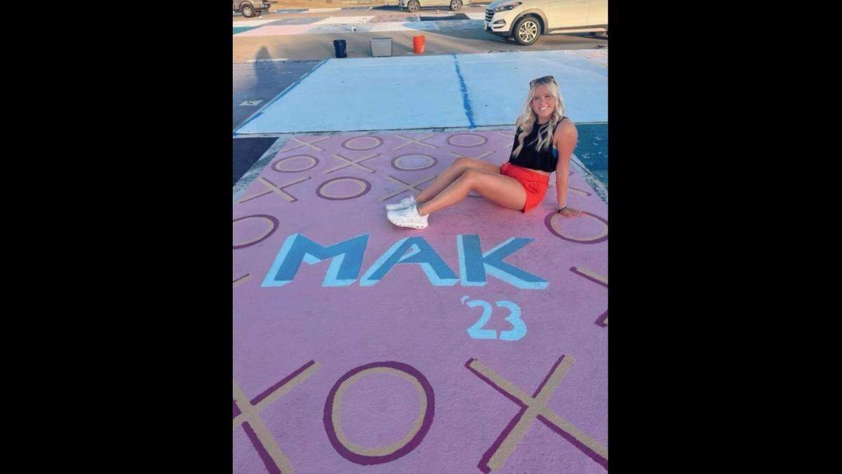 Keller High School senior Makinley King shows off her high school parking space design just days before school starts. School in the Keller district starts Wednesday Aug. 17, 2022.