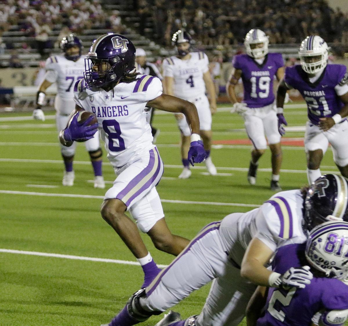 Chisholm Trail’s Omari Johnson takes the ball downfield after a reception during a UIL football game at Farrington Field Stadium on Thursday, October 4, 2024.
