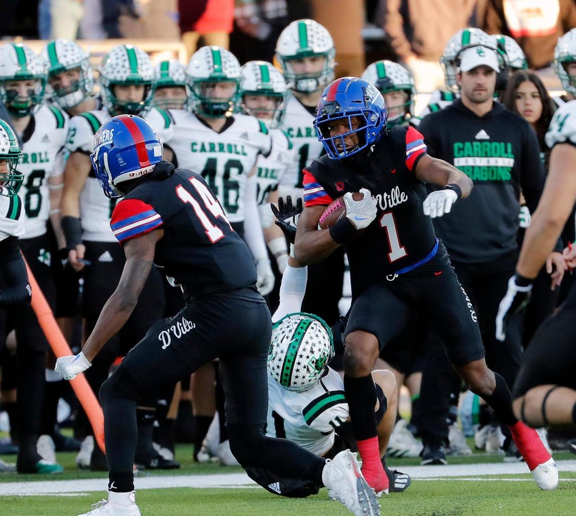 Duncanville wide receiver Lontrell Turner (1) takes a pass down the side lines during a high school Class 6A Division 1 semifinal playoff game at McKinney ISD Stadium in McKinney, Texas, Saturday, Dec. 11, 2021. Duncanville led Southlake Carroll 21-3 at the half. (Special to the Star-Telegram Bob Booth)