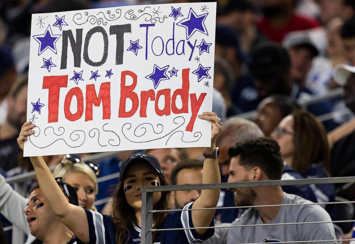 A Dallas Cowboys fan holds a sign during the 2022 season opener against the Tampa Bay Buccaneers on Sunday, September 11, 2022, at AT&T Stadium in Arlington.