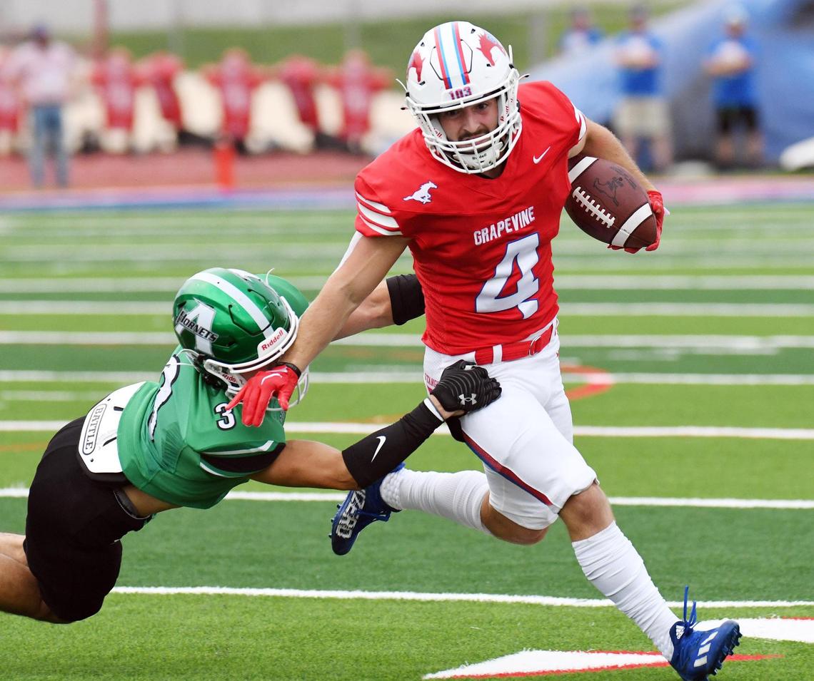 Grapevine’s Parker Polk, right breaks from the tackle of Azle’s Kaleb Vasquez for a first down in the first quarter of Thursday’s September 1, 2022 football game at Mustang-Panther Stadium in Grapevine, Texas. Special/Bob Haynes