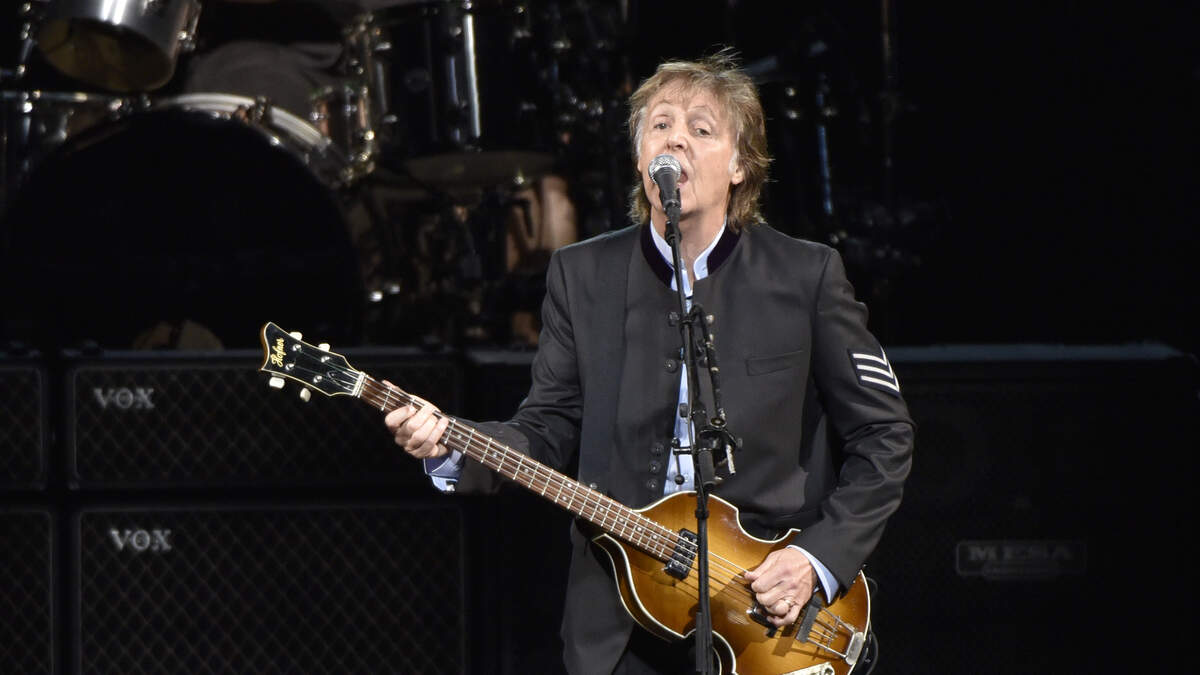 FILE - In this July 26, 2017 file photo, Paul McCartney performs on the One on One Tour at the Hollywood Casino Amphitheatre in Tinley Park, Ill. Commuters with tickets to ride out of New York’s Grand Central Station heard a special serenade on Friday evening, Sept. 7, 2018, with McCartney taking over a corner of the majestic hub for a concert. It was a stunt to promote a new album called “Egypt Station.” (Photo by Rob Grabowski/Invision/AP, File)