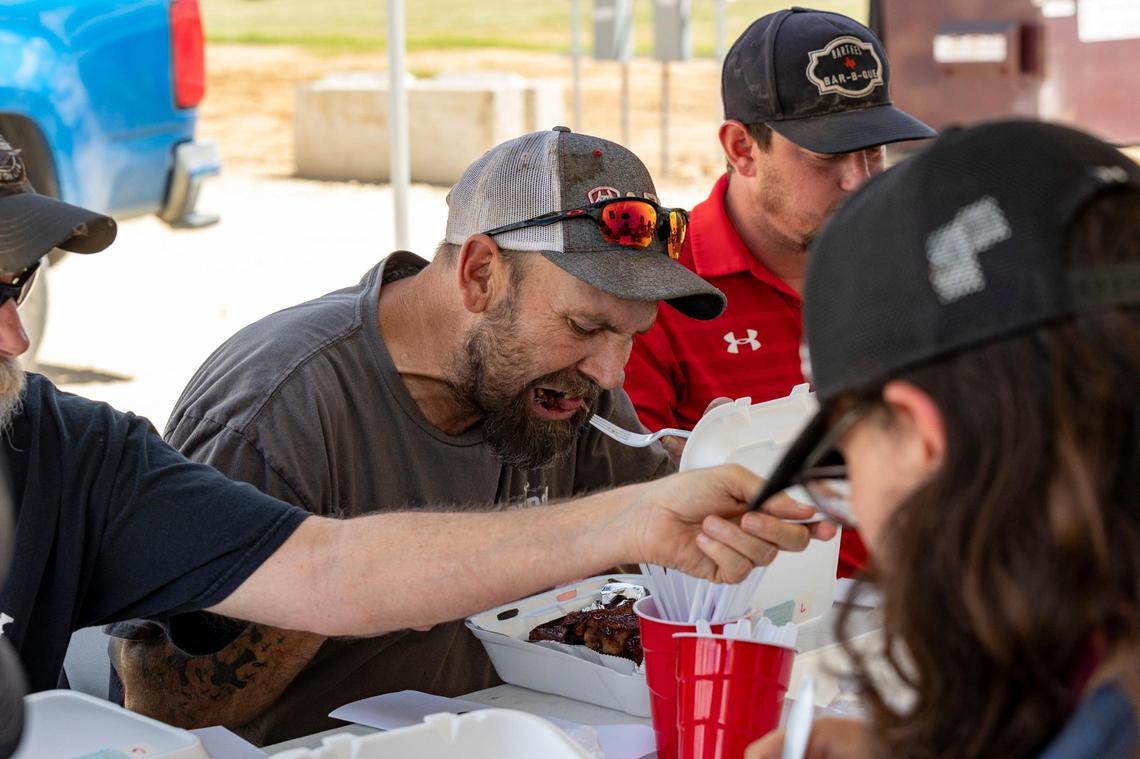 Daniel Sochkey samples a rib before passing it along during judging for the Lone Star Barbecue Society in Stephenville on Saturday, Sept. 16, 2022. The event invites folks from the community to sample three different types of smoked meat from eight competitive cooks throughout the day while a rodeo runs behind them.