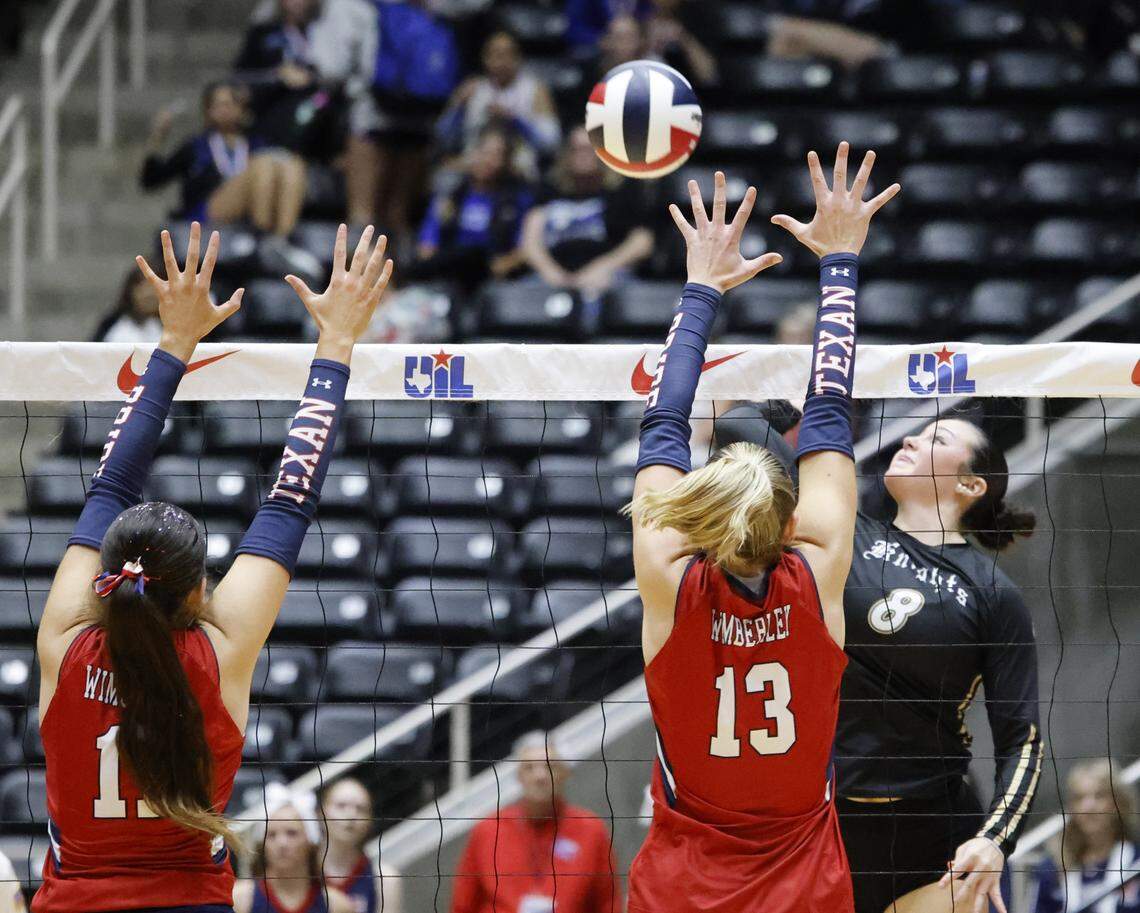 Fort Worth Eagle Mountain outside hitter Avery Williams (8) gets a shot past Wimberley right side Cameron Thames (13) during the second set of the UIL Class 4A Division II state volleyball championship game Friday Nov. 21, 2025 at Curtis Culwell Center in Garland, Texas.