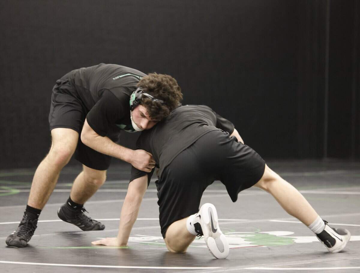 Brothers Tyler and Chase Yancey work out during one of the final practices before the state championship meet at Azle High School in Azle, Texas, on Friday, Feb. 9, 2026.