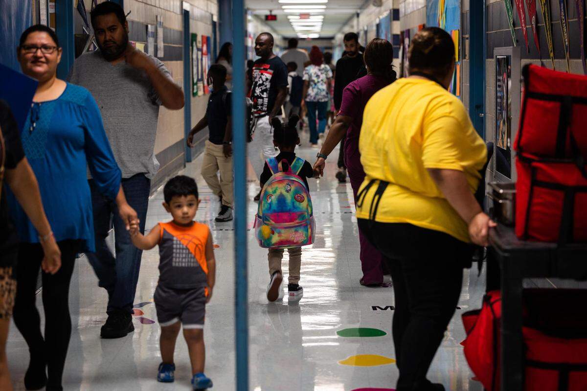 Students arrive to campus on the first day of school Monday, Aug. 15, 2022, at Clifford Davis Elementary School in Fort Worth.