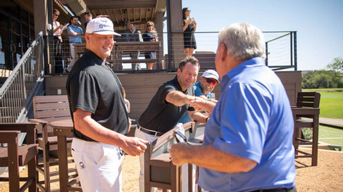 Former MLB pitcher Roger Clemens congratulates Lanny Wadkins following a shot during an event to announce the ClubCorp Classic at Las Colinas Country Club in Irving, Texas.