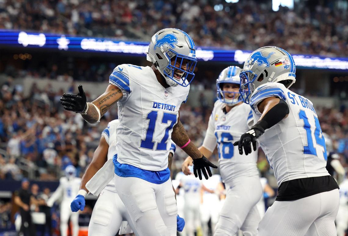 Detroit Lions wide receivers Tim Patrick (17) and Amon-Ra St. Brown celebrate after almost scoring a touchdown against Dallas Cowboys on Sunday, Oct. 13, 2024, at AT&T Stadium in Arlington.