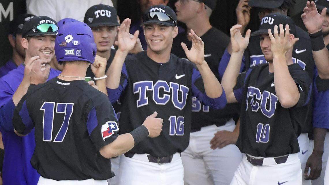 TCU players wait to celebrate with catcher Colton Parrish (17) when he scored during the second inning against Texas-Arlington on Tuesday, April 10, 2018 at Lupton Stadium in Fort Worth, Texas.