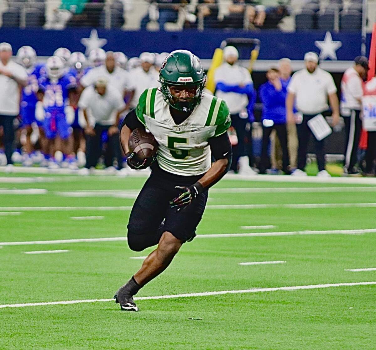 DeSoto running back SaRod Baker (5) picks up yardage against Houston King in the Class 6A Division II state championship game on Saturday, Dec. 20, 2025 at AT&T Stadium in Arlington, Texas.