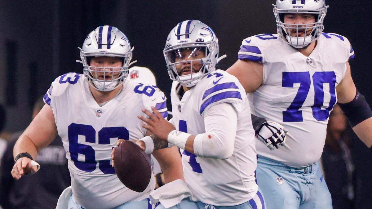 Dallas Cowboys’ Dak Prescott runs for a first down during Saturday’s win against the Eagles. But it was his arm that won the game.