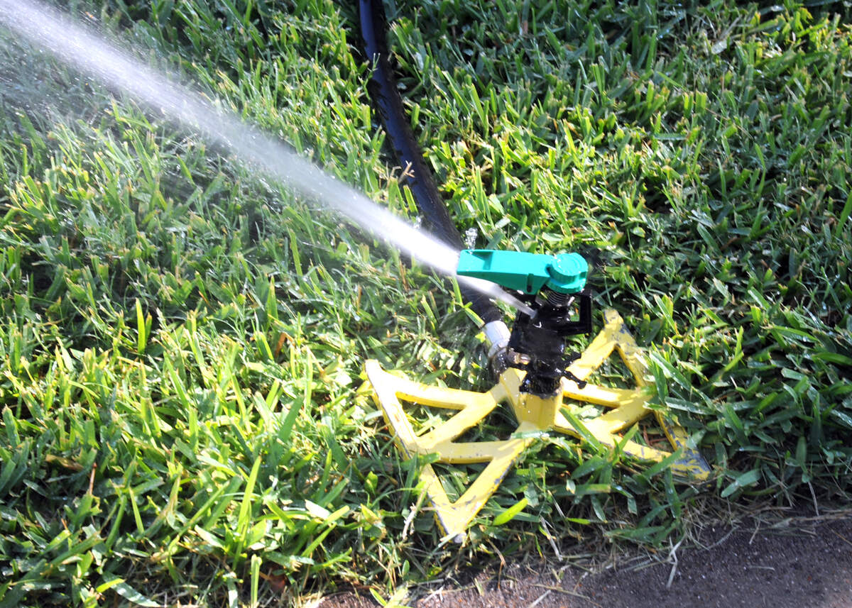 Hose-end sprinklers may be all that you need. Keep droplets low to the ground.