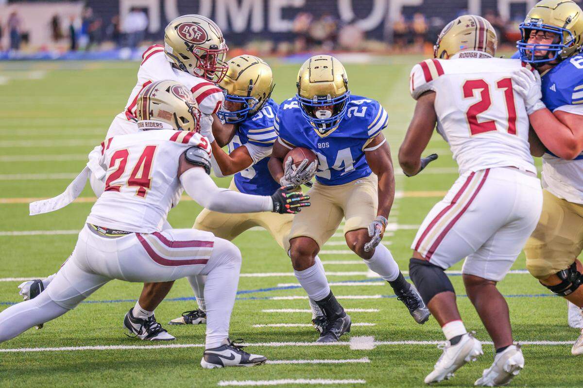 Boswell running back Chance Lassiter (8) scores a touchdown on this run against the Saginaw defense Friday at Boswell Pioneer Stadium. Special to the Star-Telegram / Tom Marvin