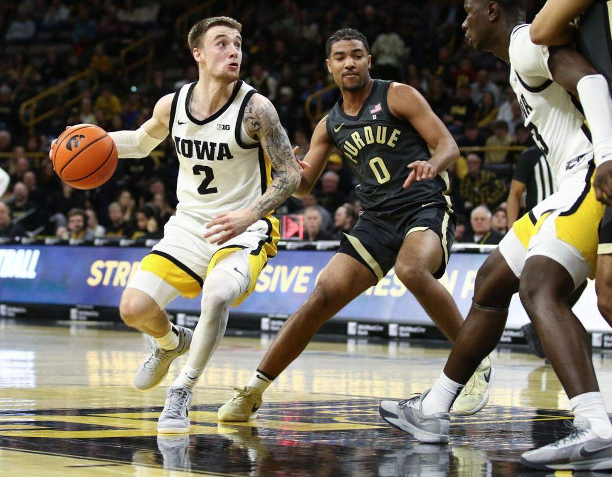 IOWA CITY, IOWA- FEBRUARY 4: Guard Brock Harding #2 of the Iowa Hawkeyes goes to the basket during the second half against guard C.J. Cox #0 of the Purdue Boilermakers at Carver-Hawkeye Arena on February 4, 2025 in Iowa City, Iowa. (Photo by Matthew Holst/Getty Images)