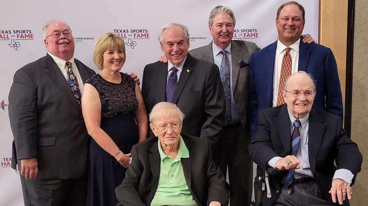 The class of 2020 posed for pictures after the induction ceremony at the Texas Sports Hall of Fame in Waco. In the back row, from left, is John McClain, Charean Williams, Brad Sham, Randy Galloway, and Mitchell Glieber (accepting on behalf of father Frank Glieber). In front, from left, are Denne Freeman and Bill Mercer. Texas Rangers radio announcer Eric Nadel was unable to attend because of a game in Houston.