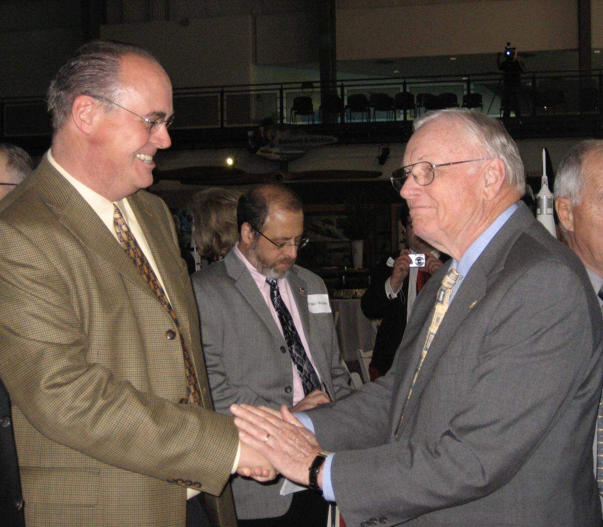 Mark Davis (left) meets astronaut Neil Armstrong in 2008 at the Frontiers of Flight Museum in Dallas.