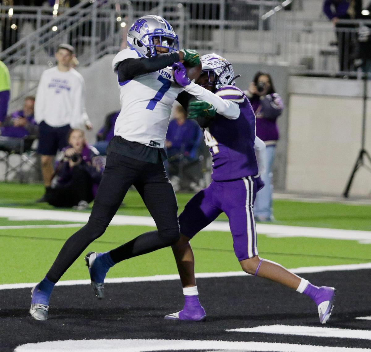 Eastern Hills Draylon McGilveary wrestles for control of a pass with Alvarado’s Javion Johnson during a UIL football playoff game at Crowley ISD Multi Purpose Stadium on Friday November 8, 2024. McGilveary comes down with it for a Eastern Hill’s touchdown.