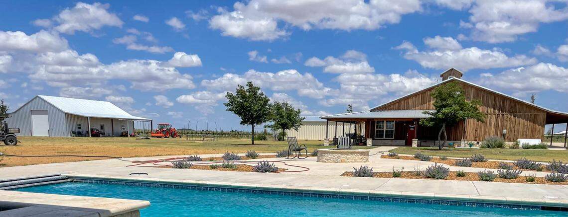 The property includes a 2,500-square-foot main house with an expansive swimming pool and separate hot tub.