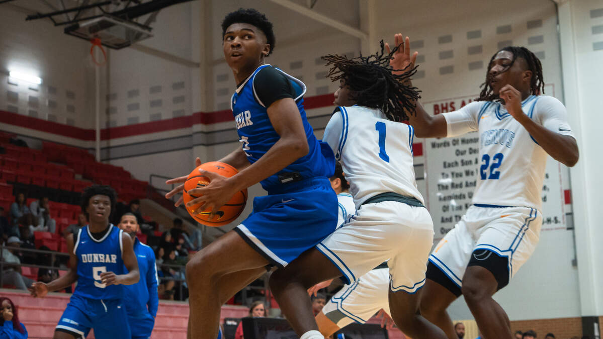 Fort Worth Dunbar’s Dwight Johnson (near left) looks for the basket as Ahmari Mahdi (1) and Donovon Suggs, Jr. (22) defend for Venus in a Classs 4A Region II bi-district game on Tuesday, February 20, 2024 at Burleson High School in Burleson, Texas. Johnson led all scorers with 29 points in Dunbar’s 90-48 win.