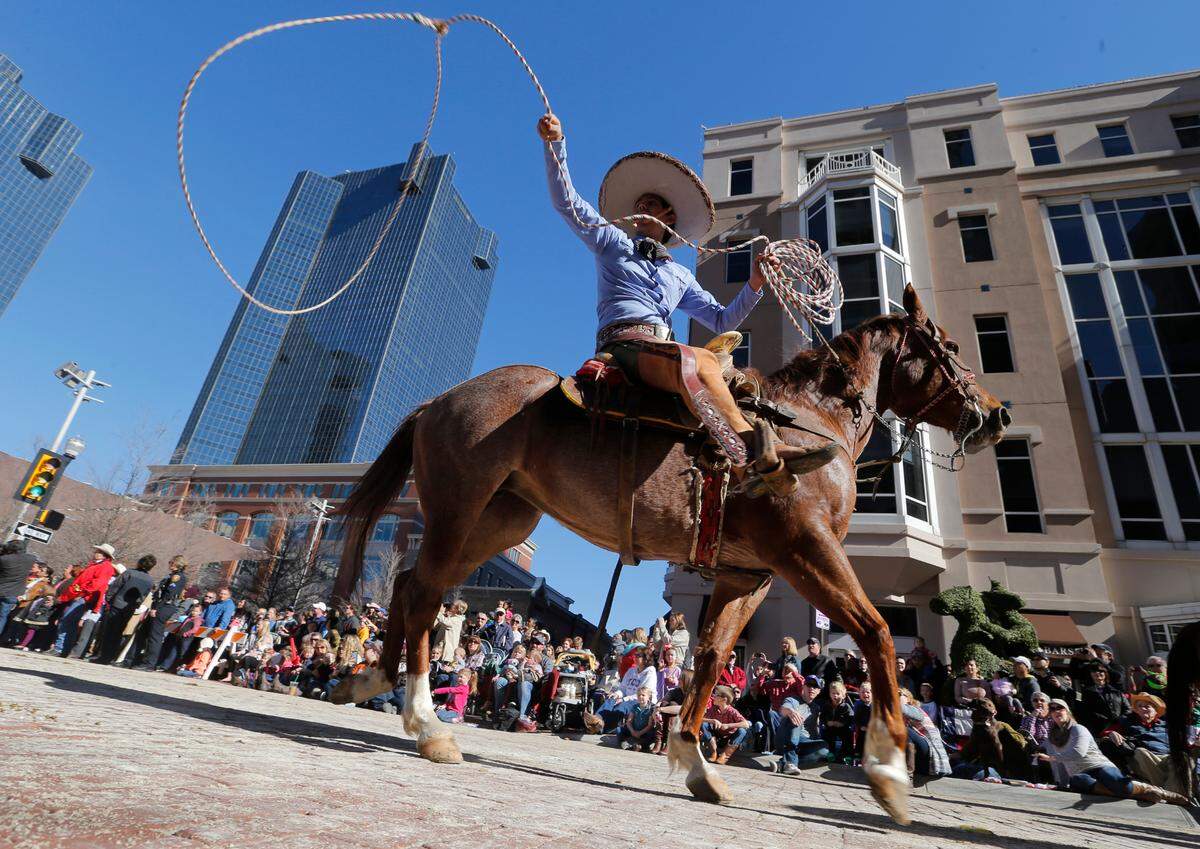 Jan. 17, 2015: Hundreds of horses and riders participate in the Stock Show Parade in downtown Fort Worth