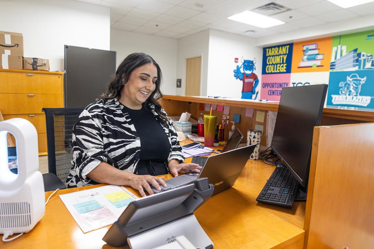 Marcela Aguayo, the receptionist and an incoming student, works at the front desk of the New Heights Adult High School in Fort Worth.