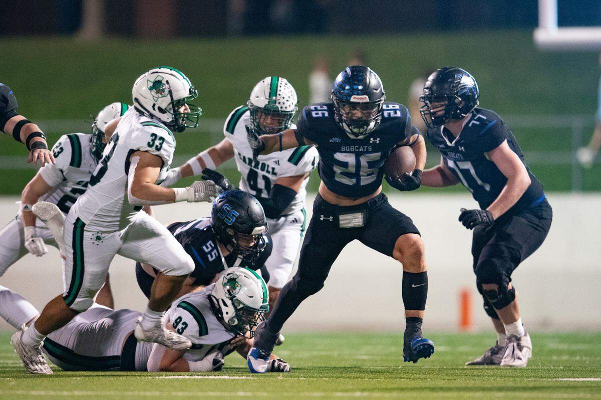 Trophy Club Nelson running back Tucker James attempts a stiff arm at Northwest ISD Stadium on Friday, Oct. 27, 2023.