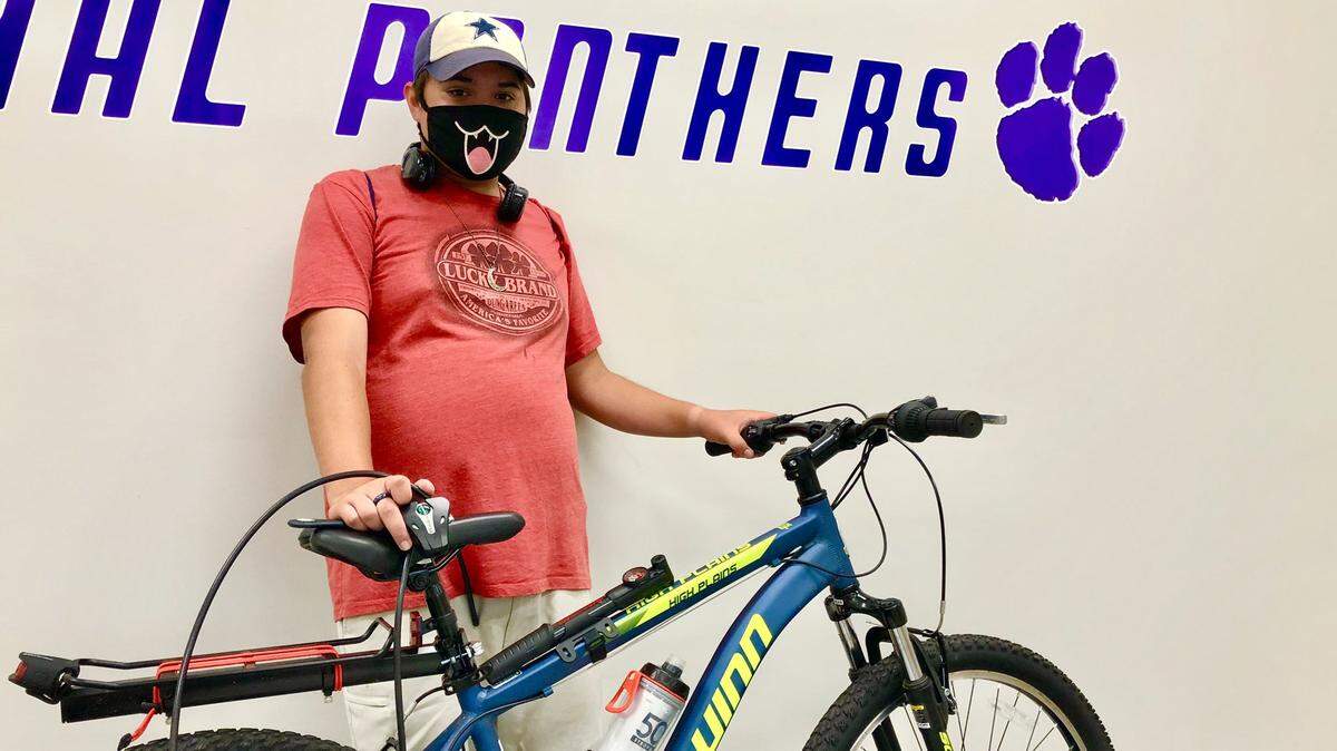 Fort Worth Paschal junior Sean Miller, who films football practices, received a new bike from the football players after his was stolen earlier in September.