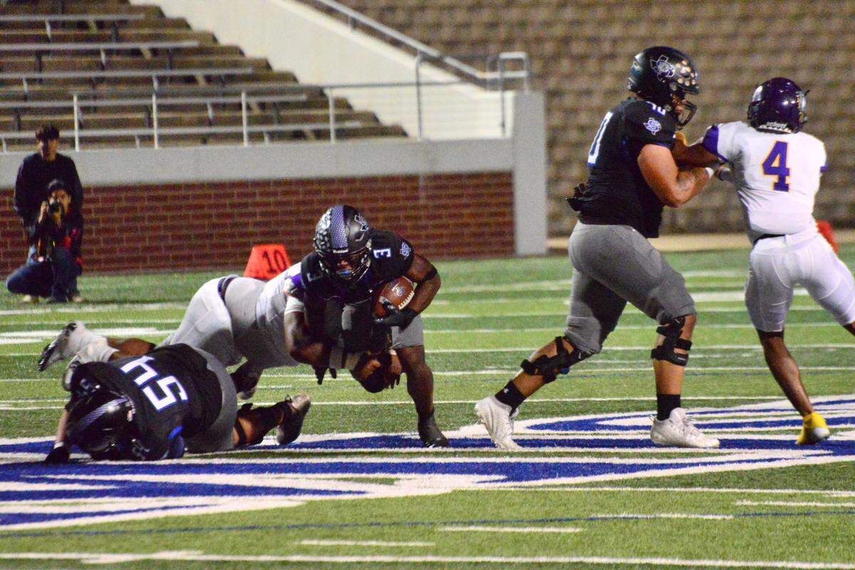 Mansfield Summit running back Adarion Nettles dives for yardage against Everman on Thursday, Oct. 31, 2024 at Newsom Stadium in Mansfield, Texas.